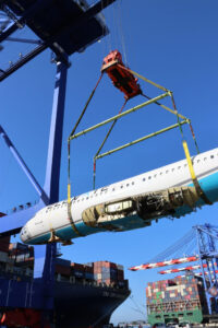 Rigging and lifting spreader bars used to lift an airplace.